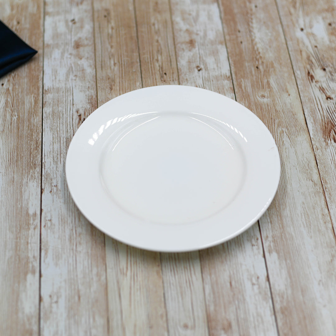 White 8-inch rolled-rim dessert plate, shallow round bowl with raised edge.