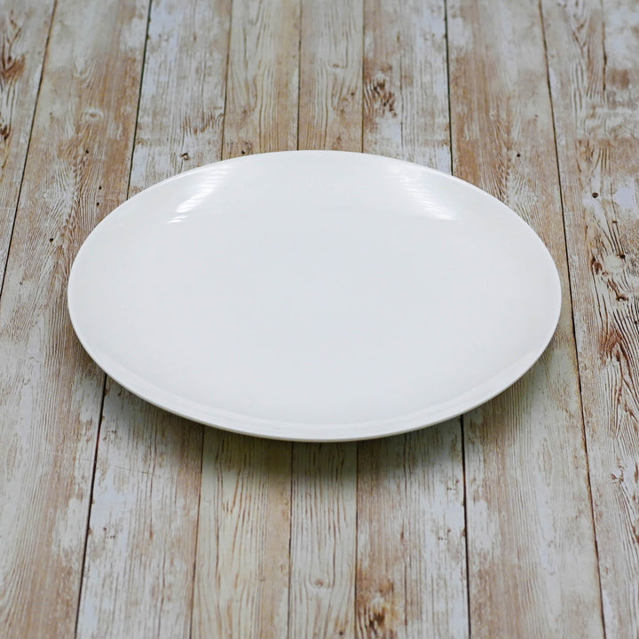 White round dinner plate, glossy finish, 10 inch size.