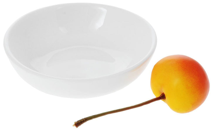 White round porcelain soy dish with shallow bowl, beside small orange