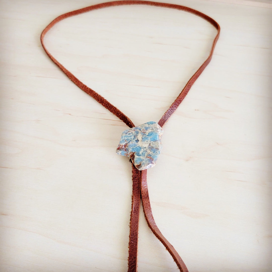 Brown leather lariat necklace with large blue aqua stone slab centerpiece and tassel ties