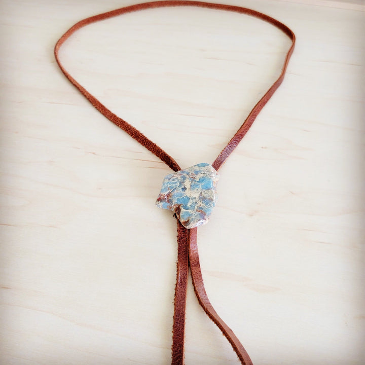 Brown leather lariat necklace with large blue aqua stone slab centerpiece and tassel ties