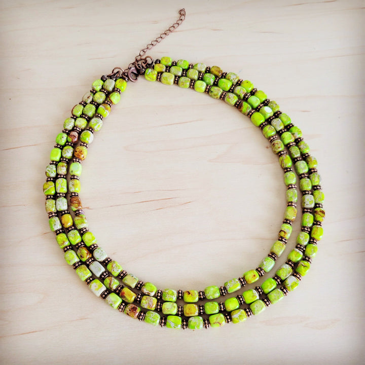 Layered beaded necklace with lime green cube beads and copper chain extender