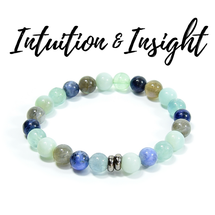 Intuition &amp; Insight Vibes bracelet with pastel aqua beads, dark blue beads, and silver center link
