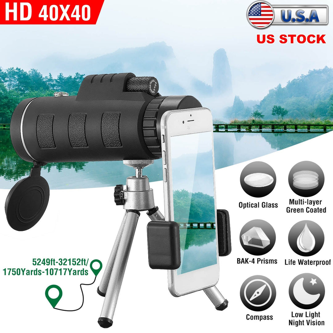 Black monocular telescope with tripod and phone holder, lens facing forward.