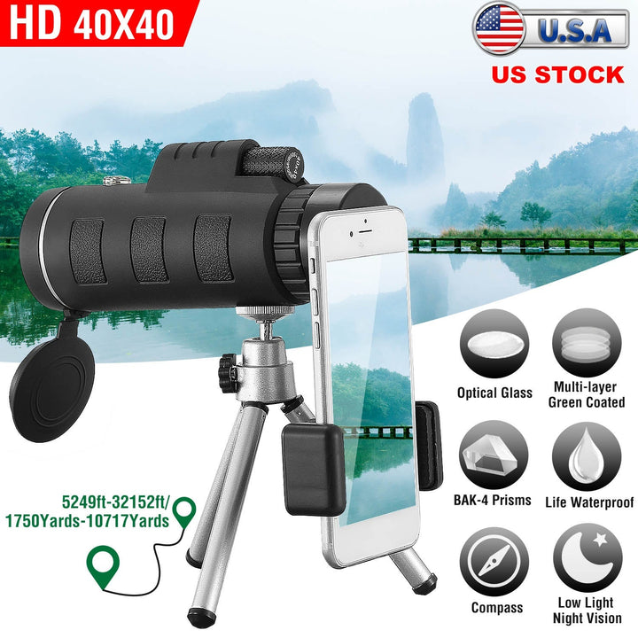 Black monocular telescope with tripod and phone holder, lens facing forward.