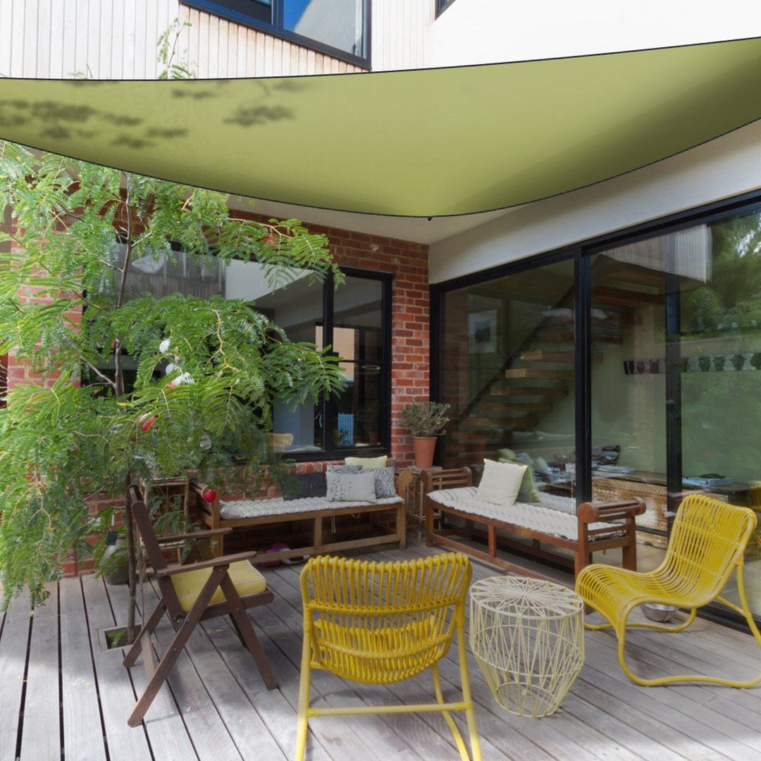 Olive triangular shade sail canopy overhead on outdoor patio