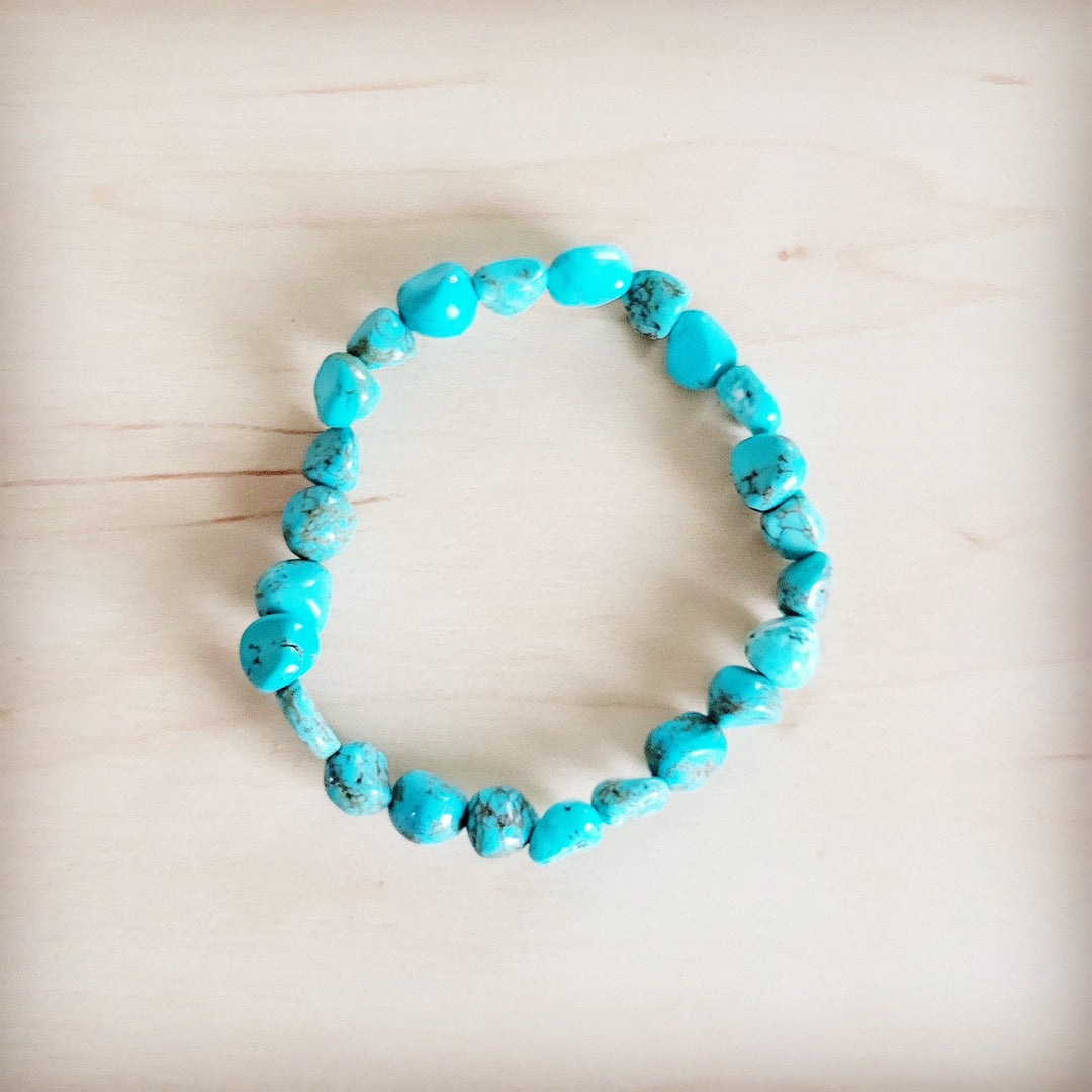 Small turquoise beaded stretch bracelet with mixed round and oval beads