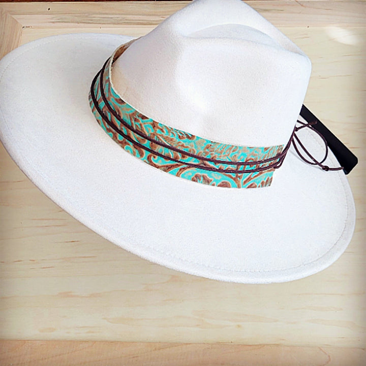 Turquoise leather cowboy hat band with embossed swirl pattern and dark leather tie ends