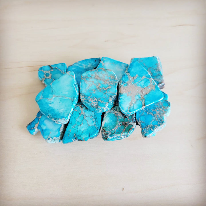 Turquoise stone slab belt buckle with rounded center stone and blue veining
