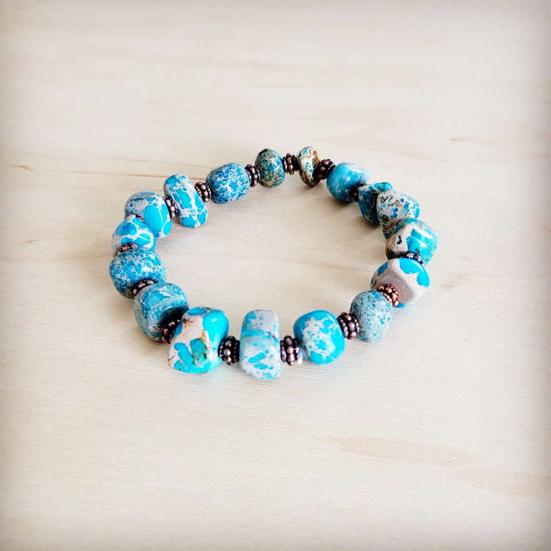 Turquoise and copper beaded stretch bracelet with round beads and metal spacers
