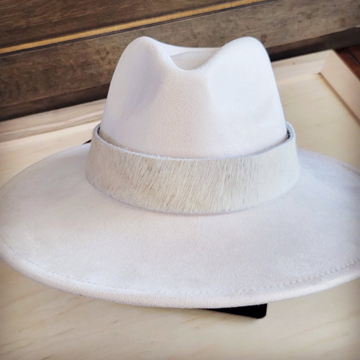 White wide-brim felt hat with dark band and textured edge