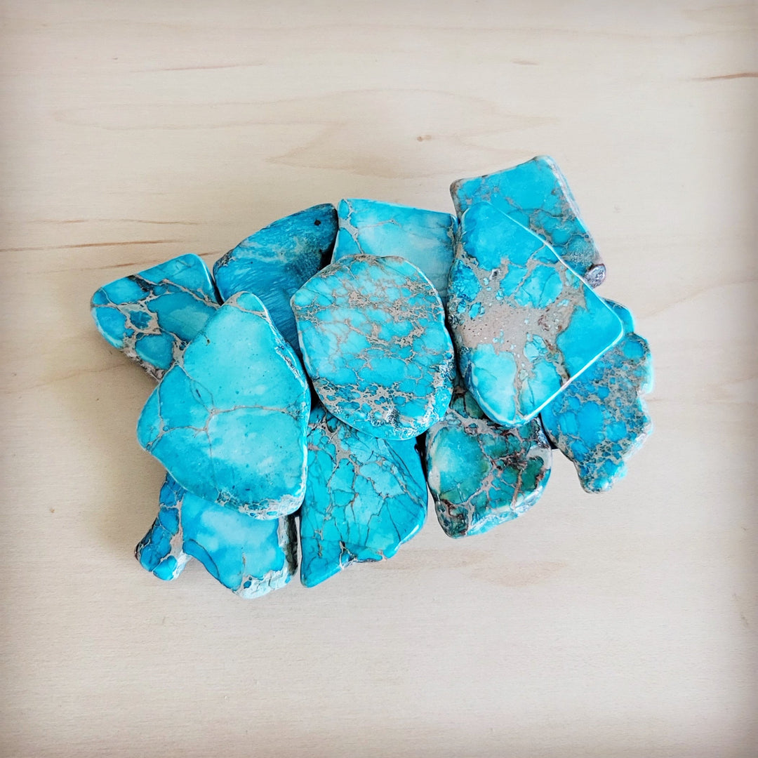 Turquoise Regalite slab belt buckle with scalloped stone edges and silver metal frame