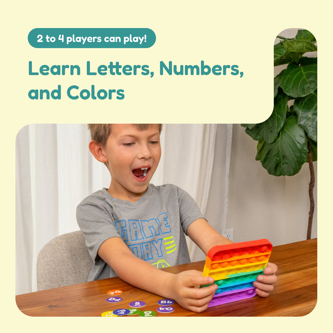 ABC Bingo fidget game play scene with child holding a rainbow pop-it style token board