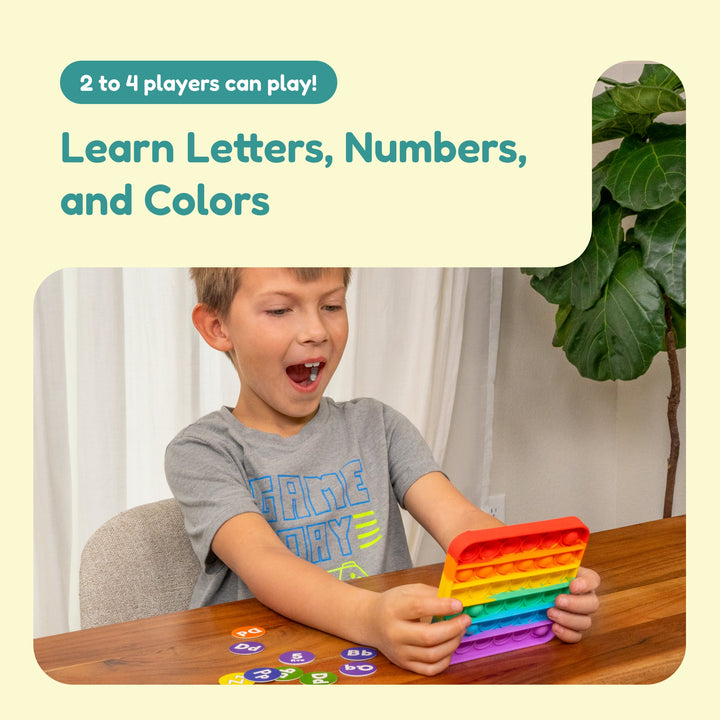 ABC Bingo fidget game play scene with child holding a rainbow pop-it style token board