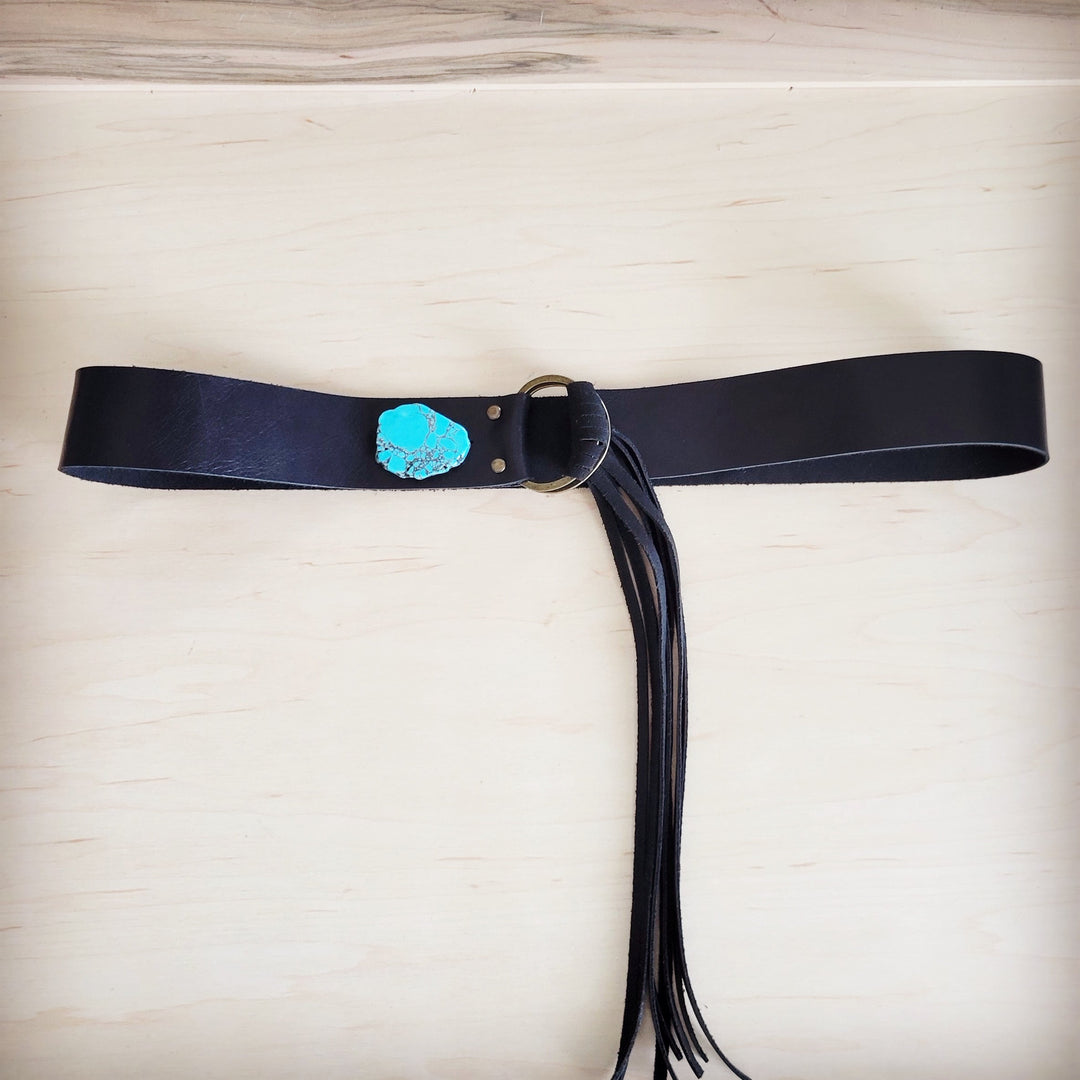 Black leather belt with turquoise stone plate and circular buckle, fringe tassels
