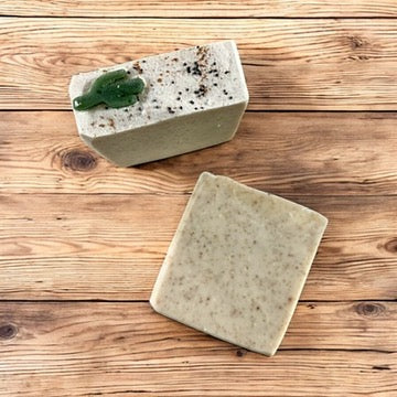 Handmade sandalwood smoke soap bar, speckled with black and green accents, rectangular