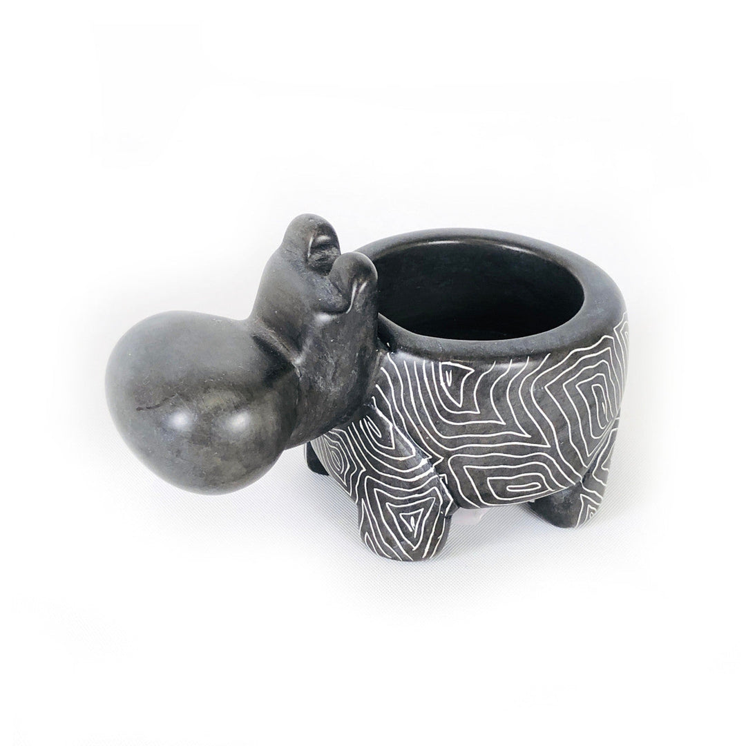 Gray soapstone hippo tealight holder with round candle cup on its back