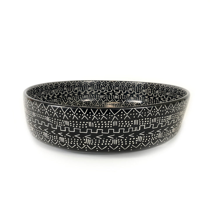 Black mud cloth style bowl with raised rim and white geometric band