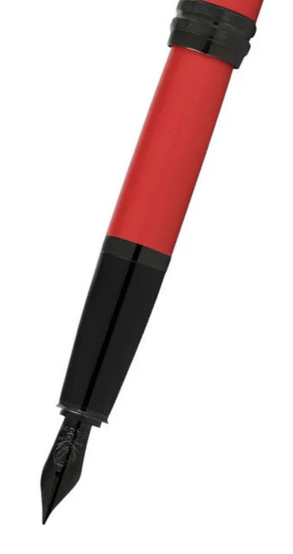 Red matte lacquer fountain pen close-up of black nib and grip band