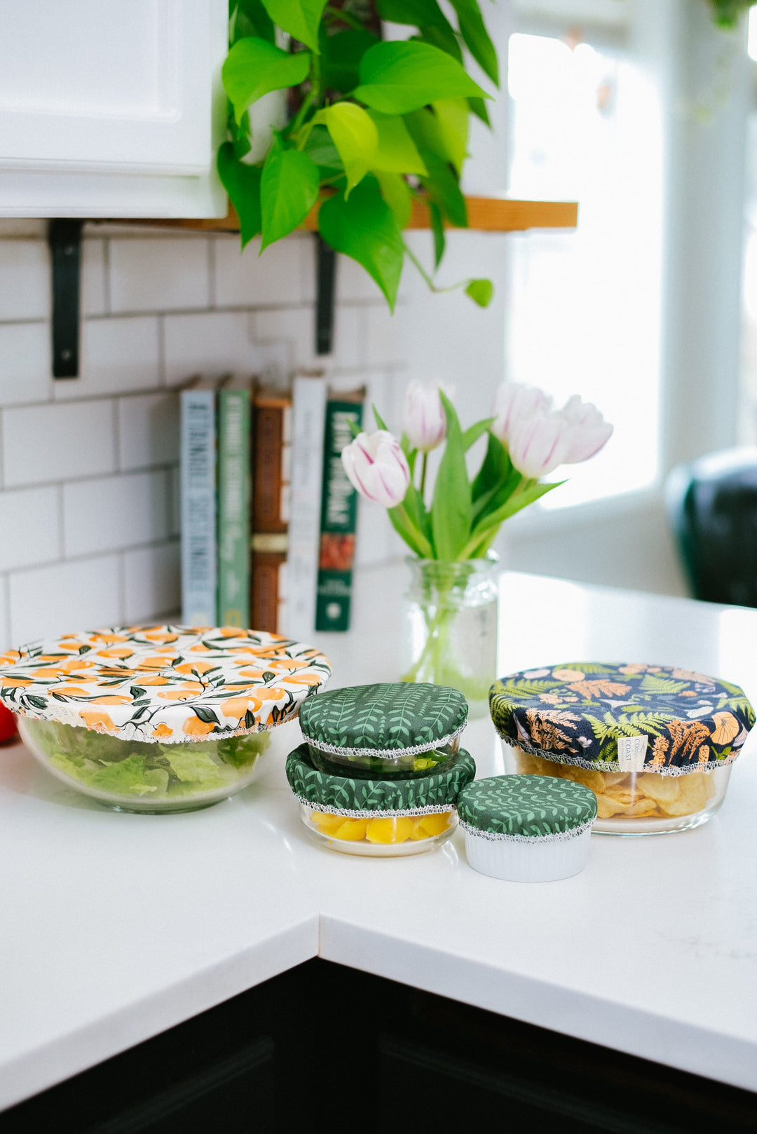 Patterned fabric bowl covers in assorted designs and sizes on kitchen counter