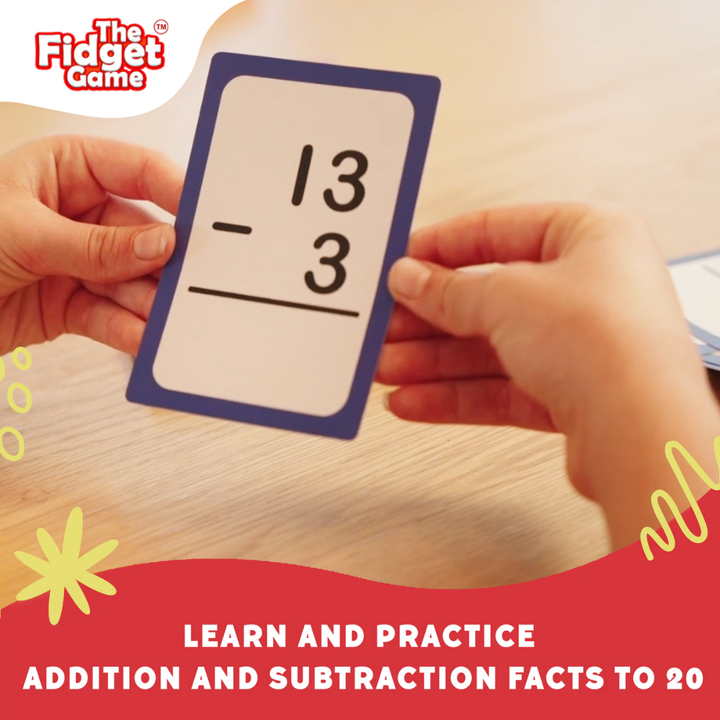 Hands holding a subtraction equation card showing 13 minus 3.