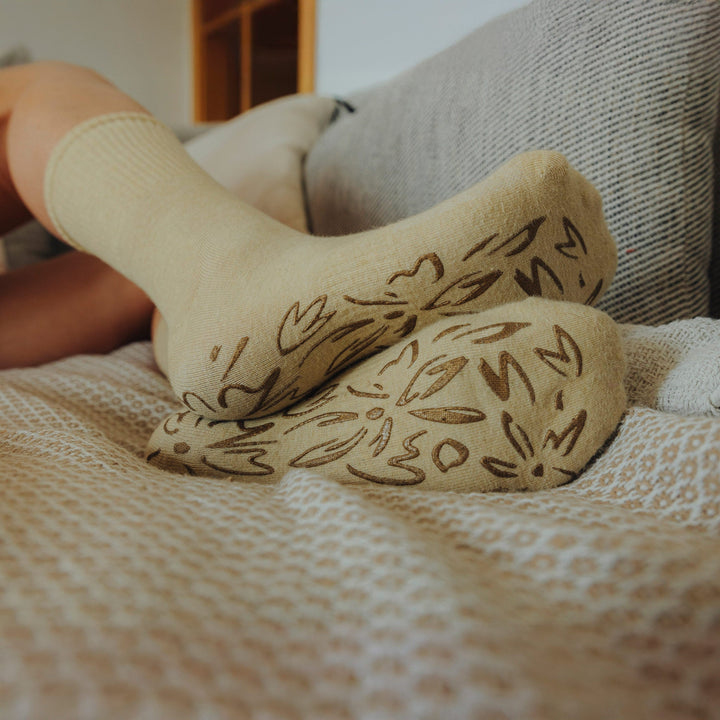 Lemon-color non-slip grip socks with dark patterned sole