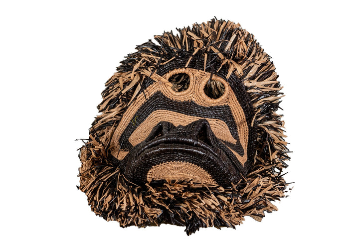 Spider monkey face mask with brown-and-black woven fringe and stitched facial details