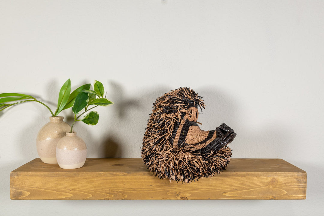Spider monkey face mask rear 3/4 view with dense brown woven fringe