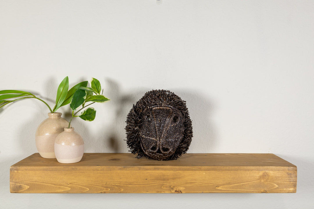 Spider monkey wall mask with dark textured shag back and oval face panel outline