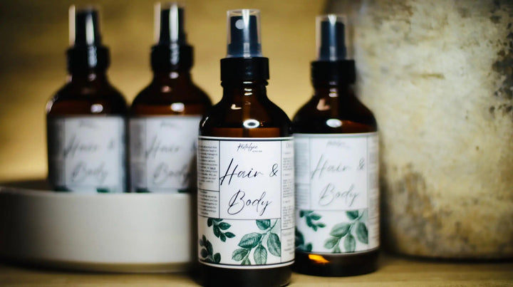 All-natural hair and body oil bottles, three-pack, black glass with leaf label