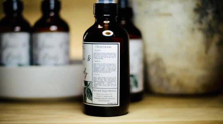 All-natural hair and body oil bottle back label, text panel with green leaf design