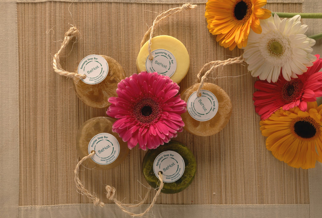 Assorted small round soap bars on rope with white circular labels