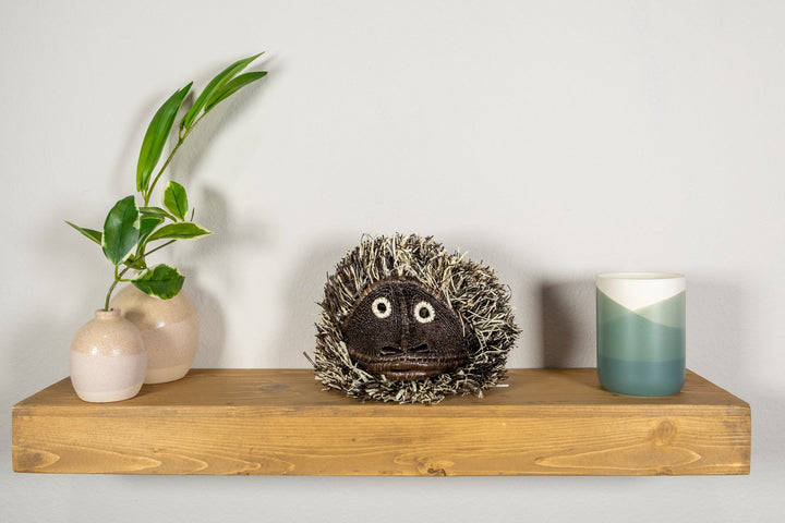 Tufted monkey face mask with dark shag fur and large round cartoon eyes