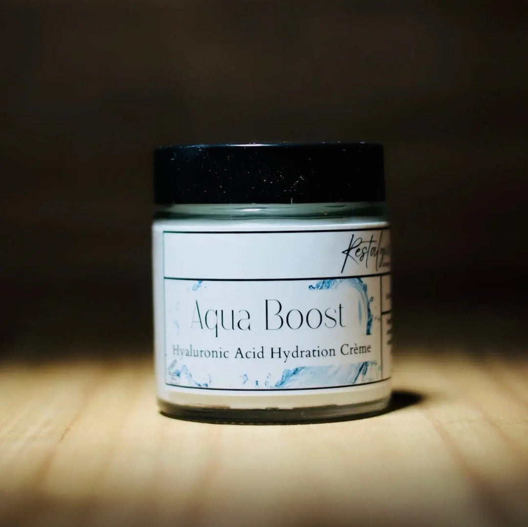 Aqua Boost hyaluronic acid hydration crème in a glass jar with black lid