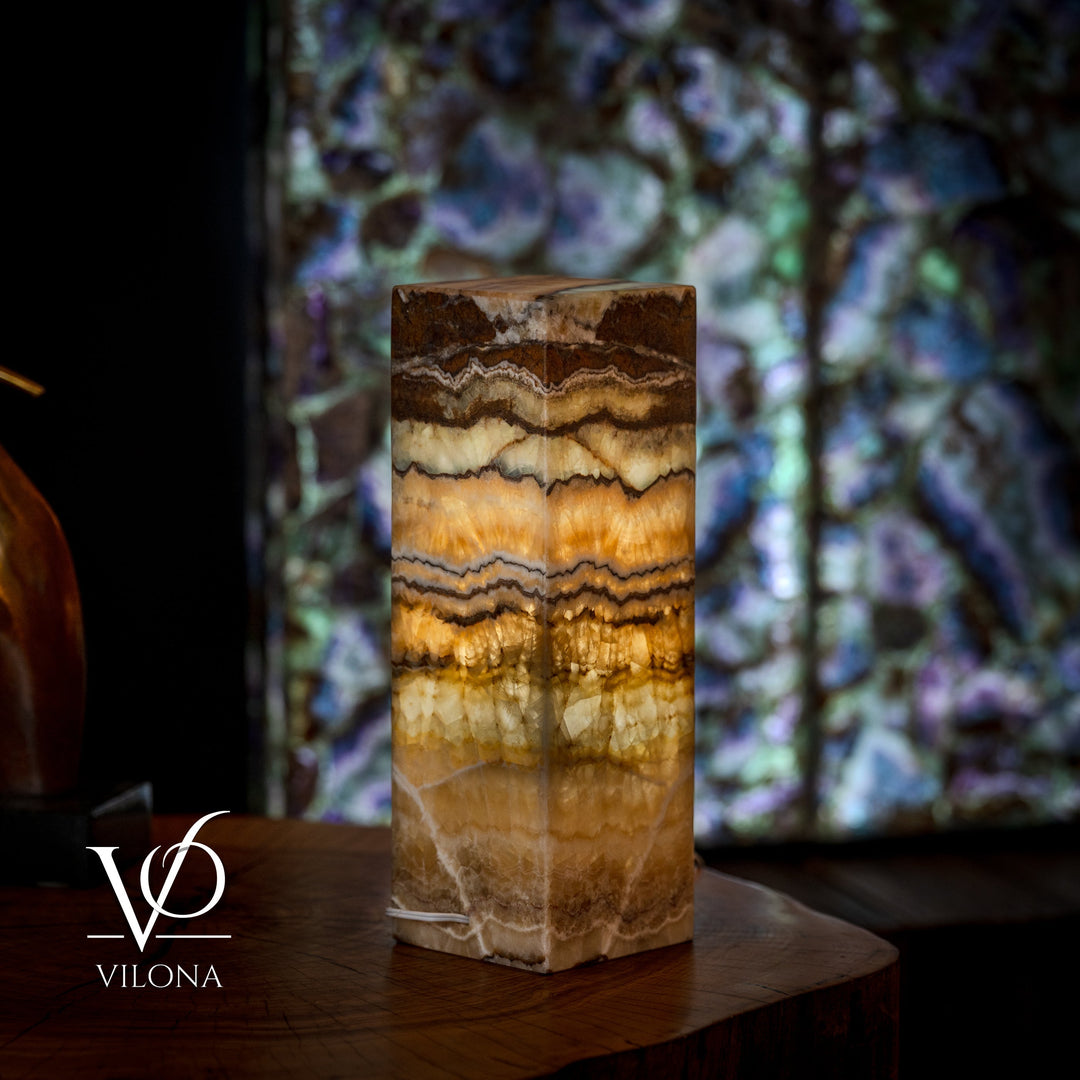 Small onyx table lamp base, square top, warm amber and cream banded stone texture