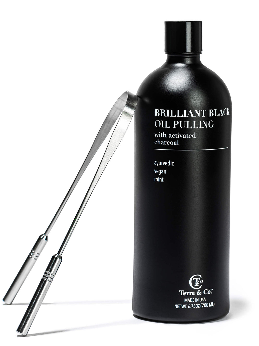 Black oil pulling bottle with stainless steel tongue scraper tools