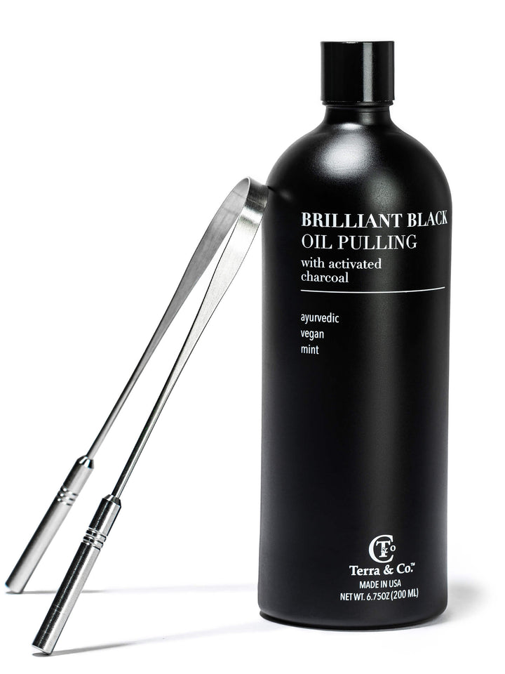 Black oil pulling bottle with stainless steel tongue scraper tools