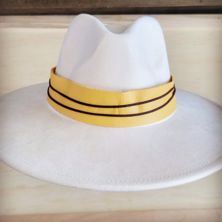 White felt wide-brim hat with mustard leather band and black double stitching