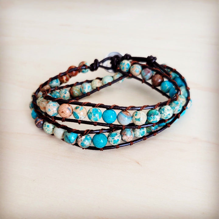 Turquoise and white beaded leather double-wrap bracelet with dark cord straps
