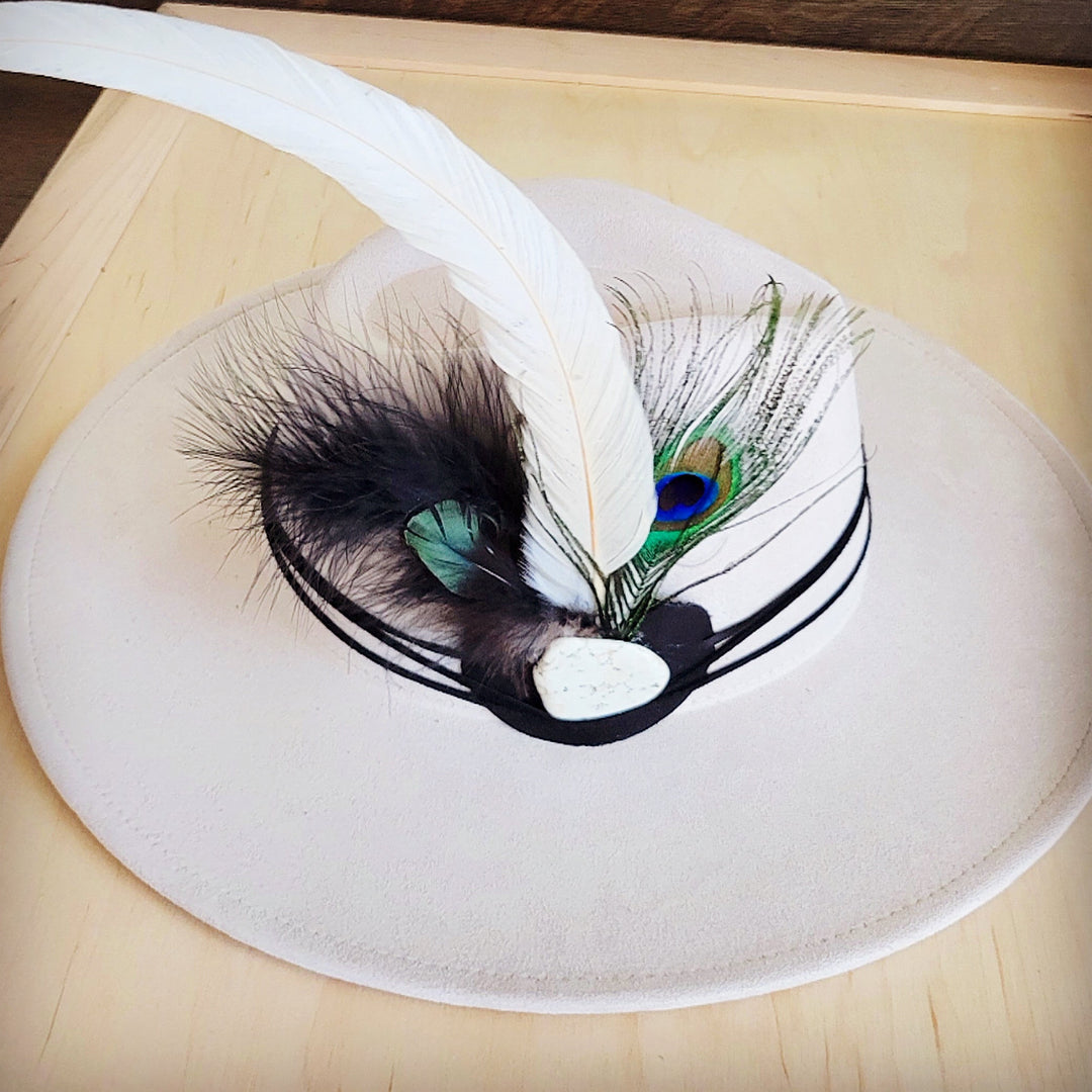 Peacock feather and turquoise leather hat band with black-and-white plume detail