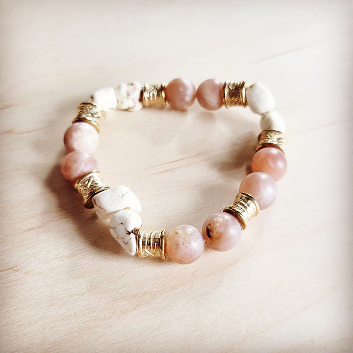 Beaded stretch bracelet with pastel pink and white stones plus gold-tone barrel details