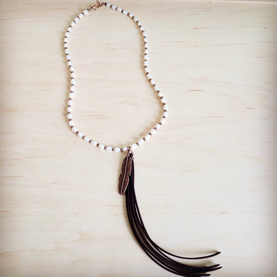 Long pearl and copper bead necklace with feather tassel pendant