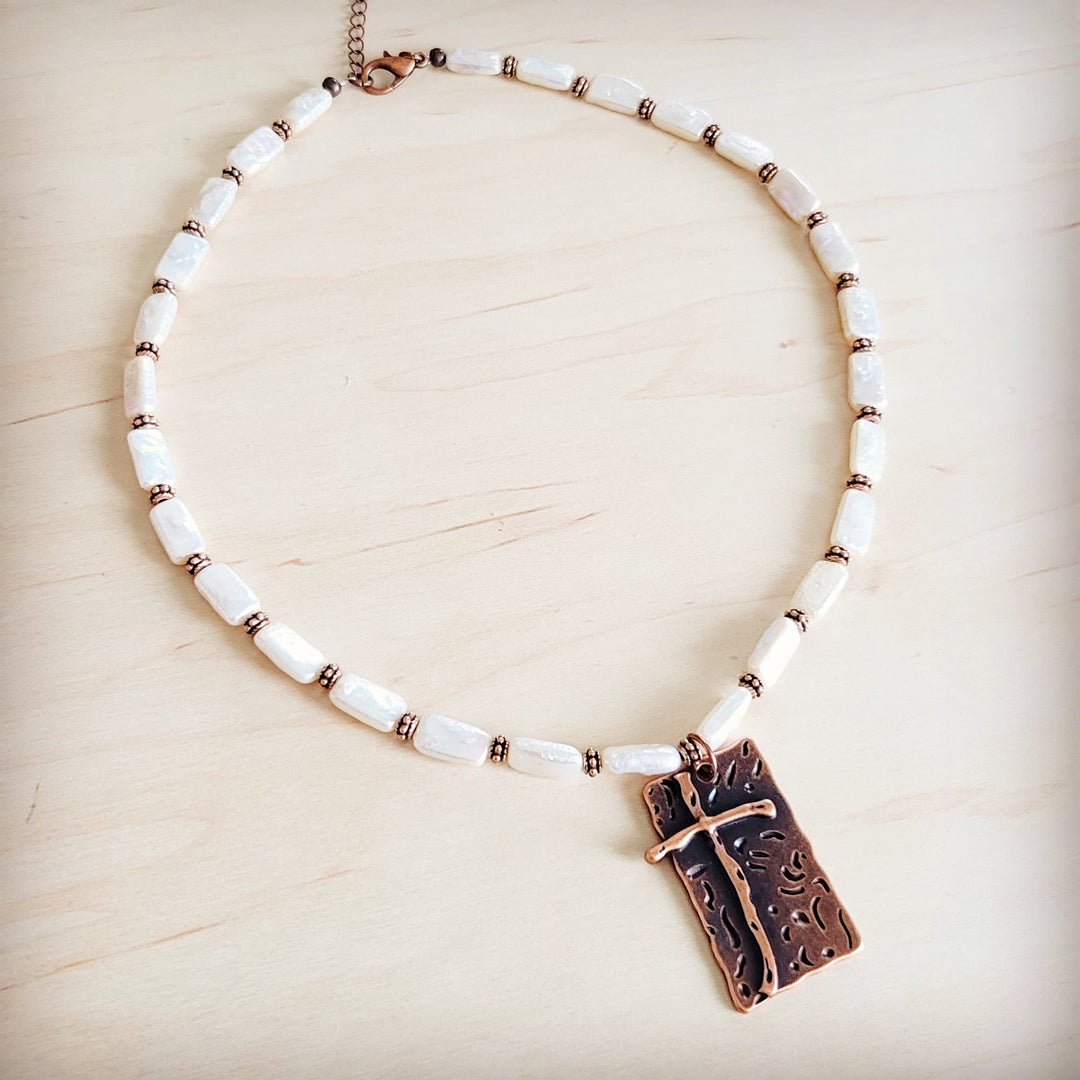 Freshwater pearl and copper-tone beaded necklace featuring antique cross pendant