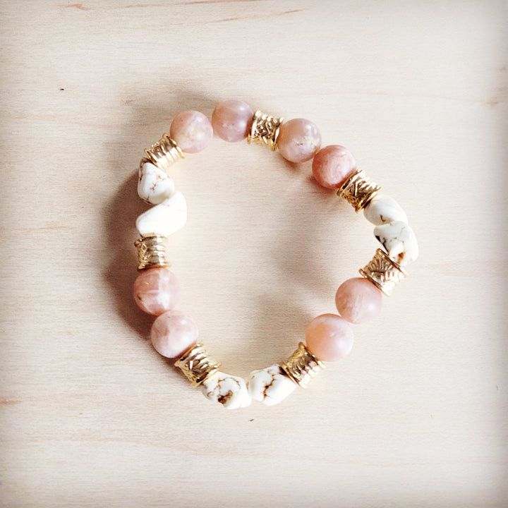 Pink and white bead stretch bracelet with gold-tone spacer beads