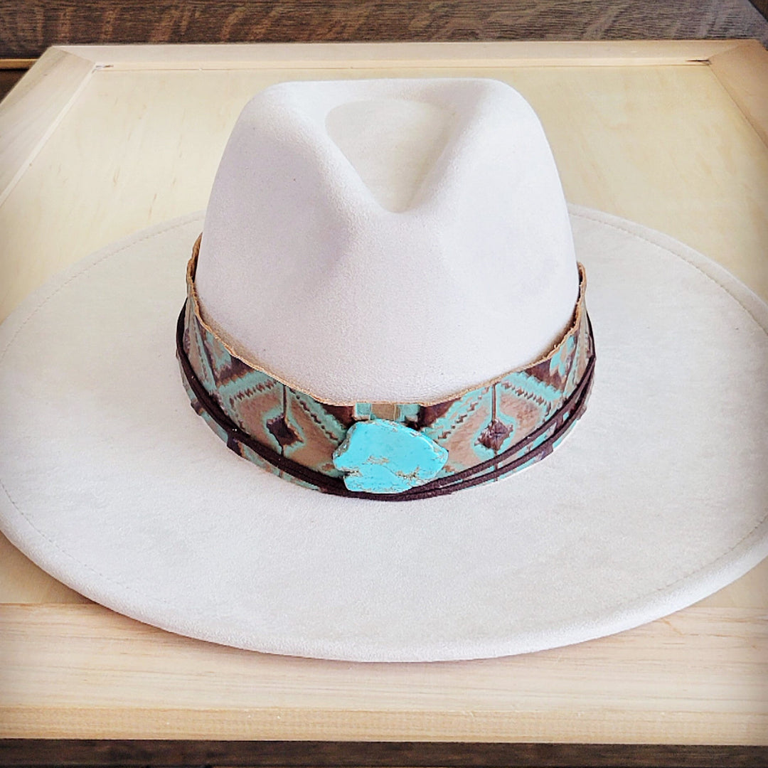 White felt cowboy hat with wide turquoise leather band featuring stamped pattern