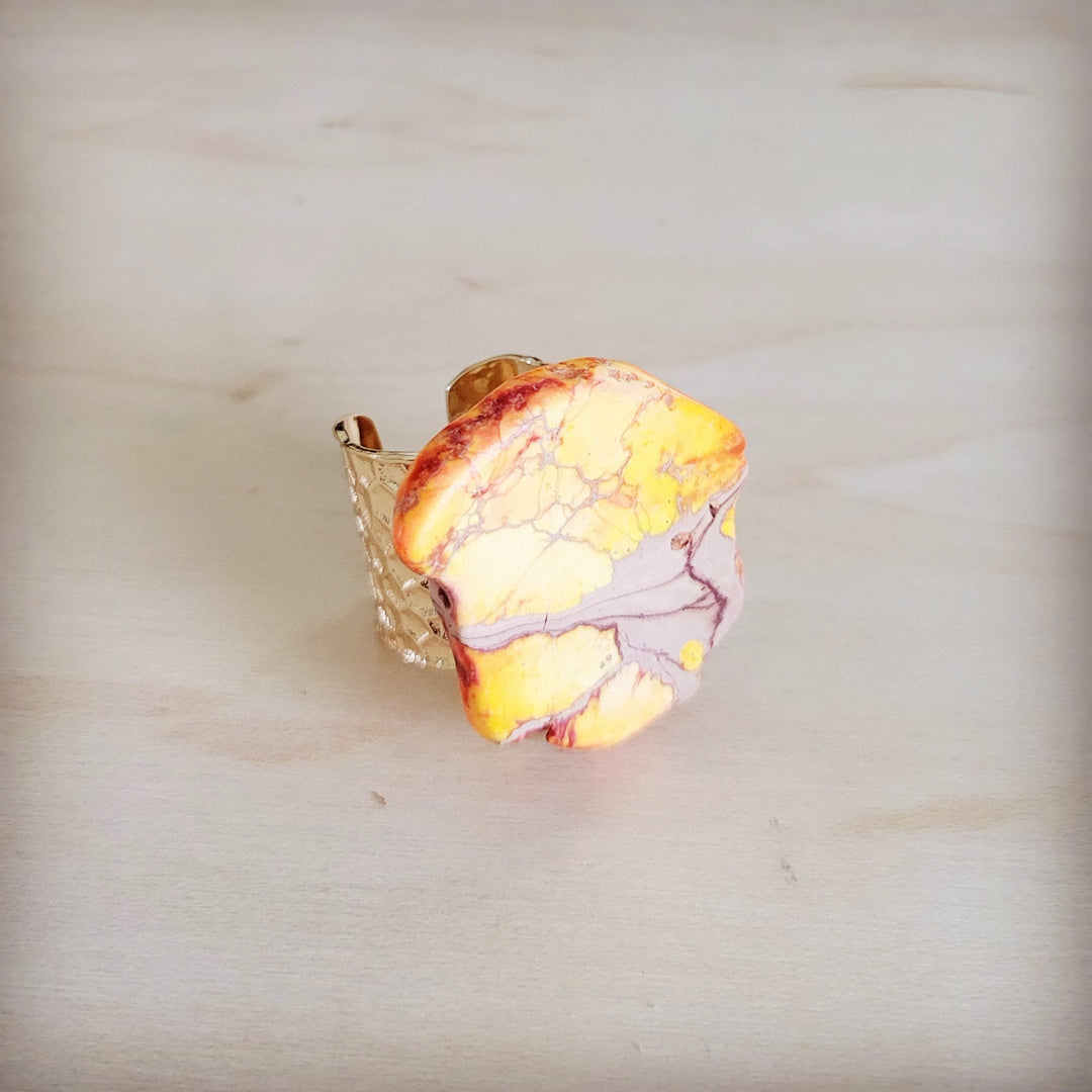 Orange-yellow marbled resin statement ring with gold-tone open band