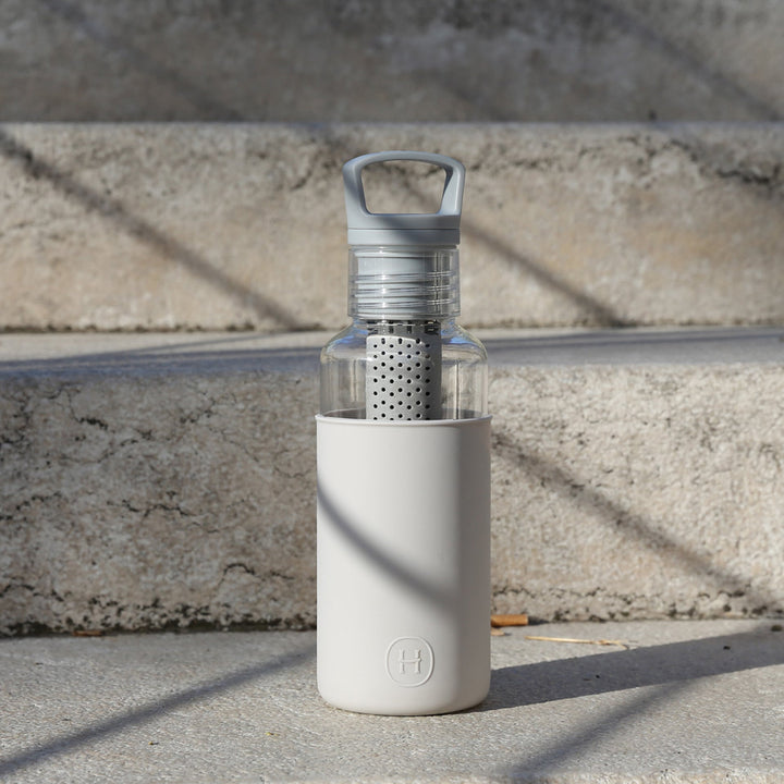 20 oz grey insulated bottle with flip-top lid and open clear infuser