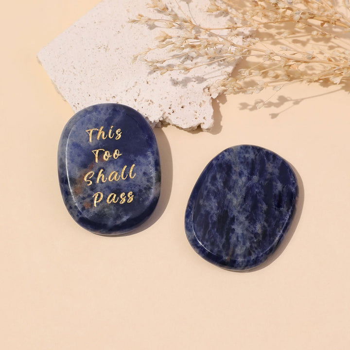 Pocket crystal stone, dark blue oval with engraved “This Too Shall Pass” text