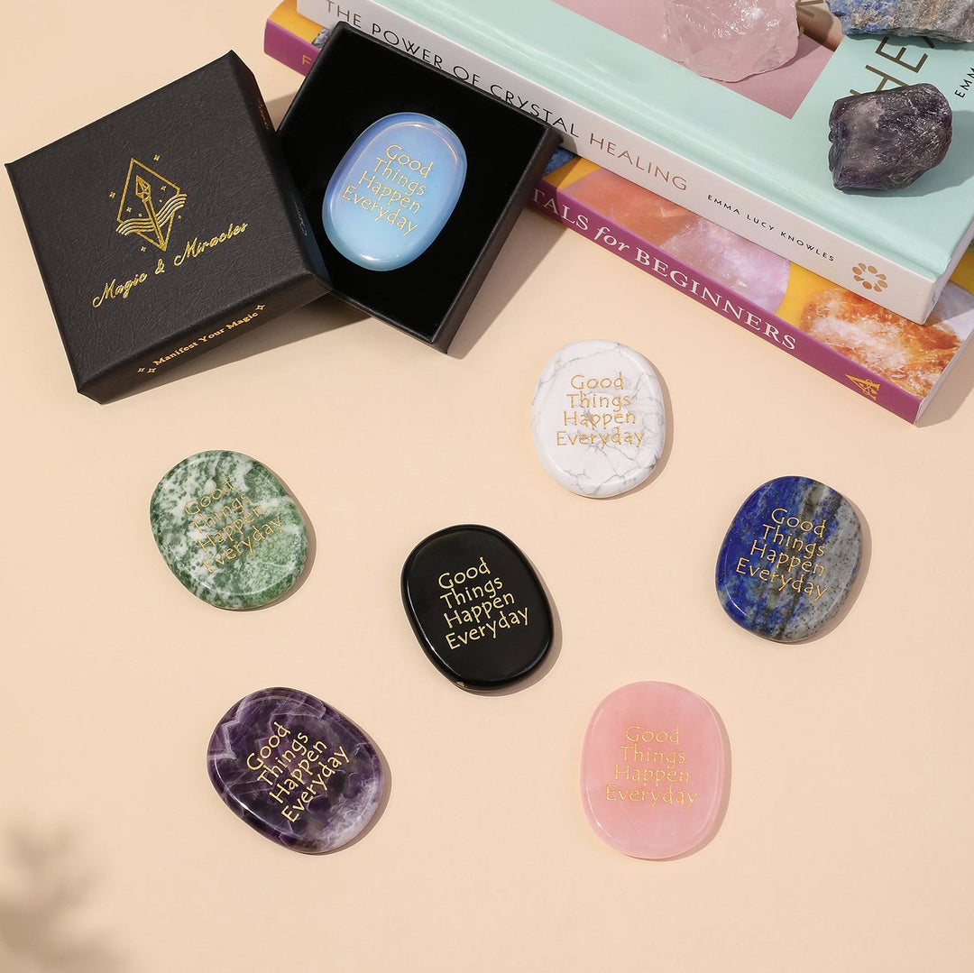 Assorted oval pocket crystal stones, including purple and pink, with “Good Things Happen Everyday”