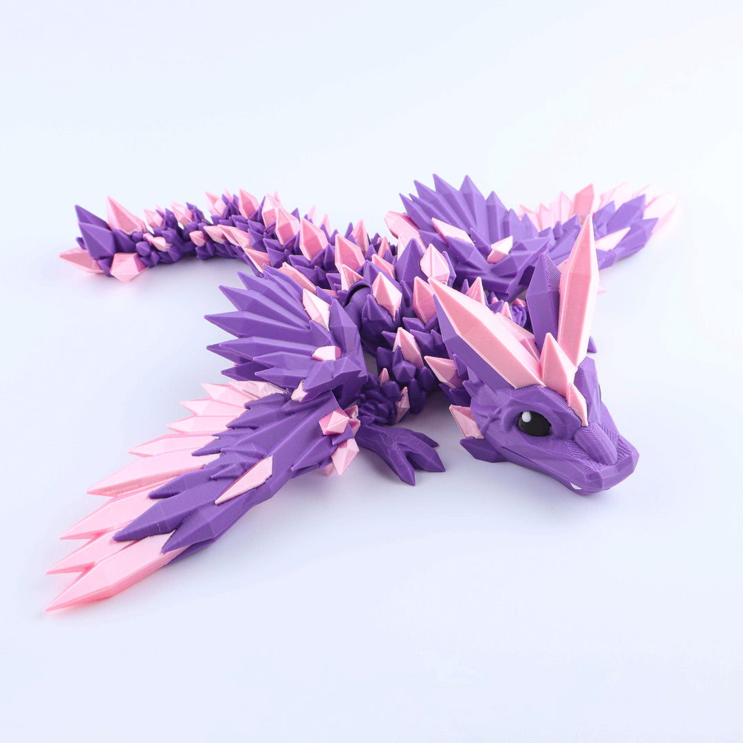 Purple and pink crystal wing baby dragon fidget toy with articulated spiked body